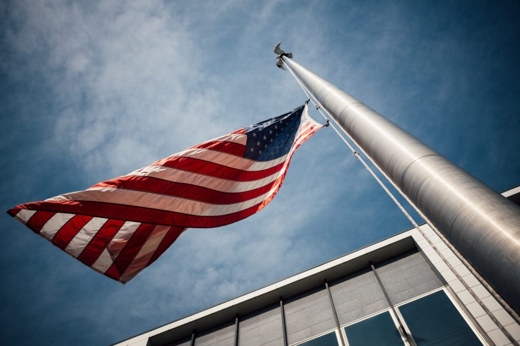 American flag half staff on a flag pole